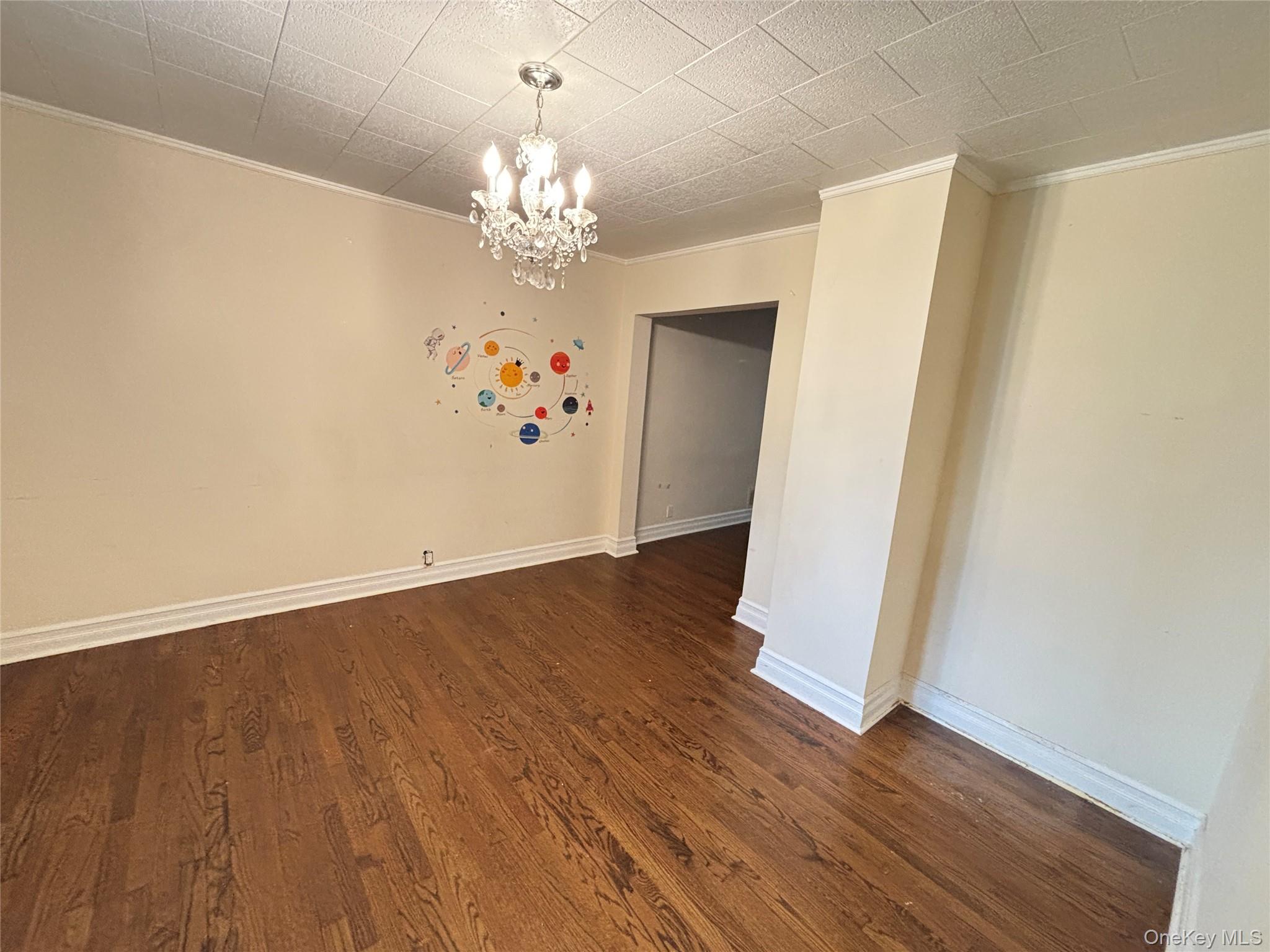 45 John Street New Rochelle, NY 10805 - Photo 5 of 14 a view of a room with wooden floor and chandelier