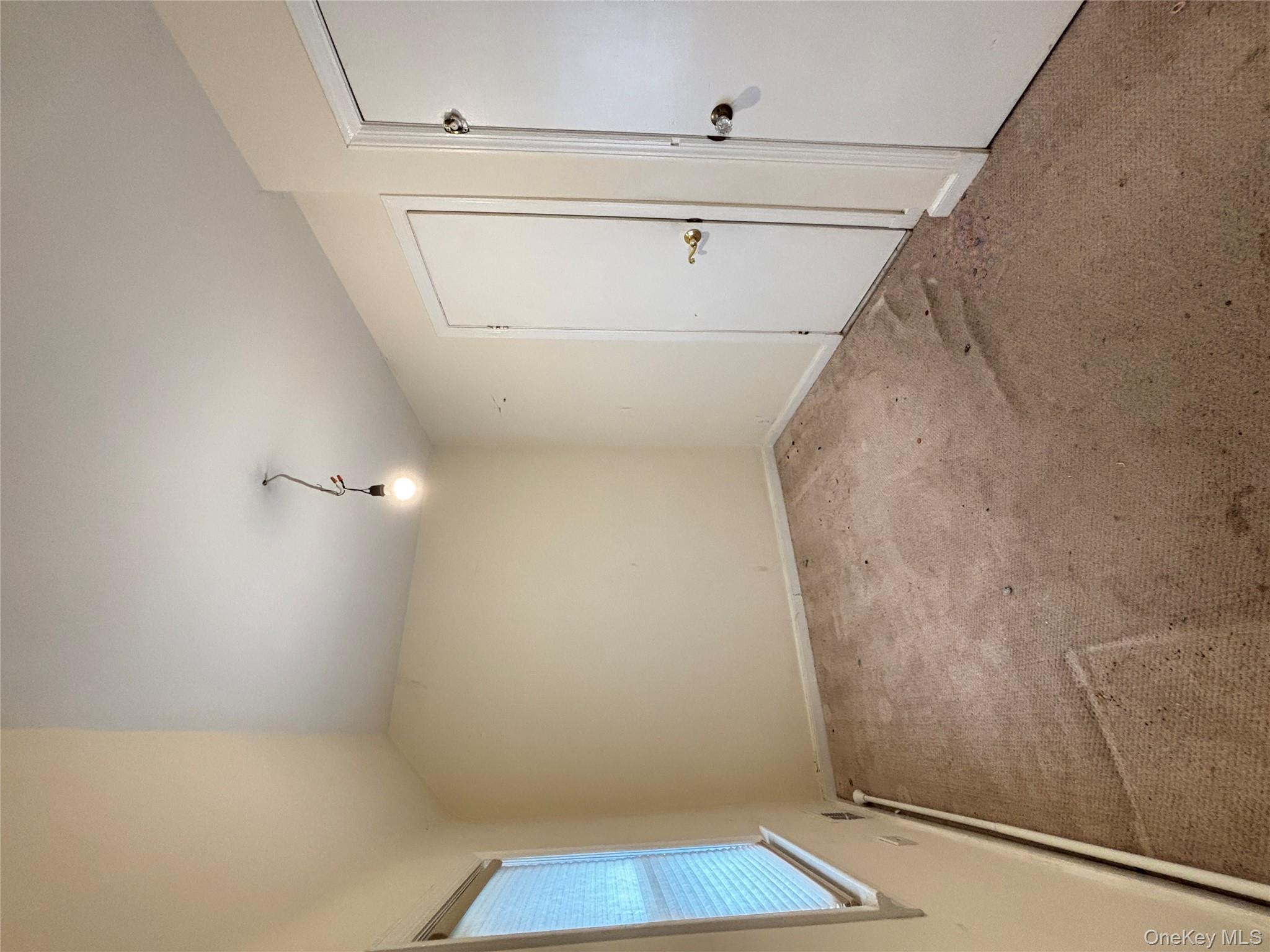 45 John Street New Rochelle, NY 10805 - Photo 8 of 14 a view of an empty room with a window