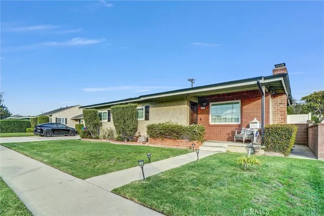 a view of a backyard with sitting area