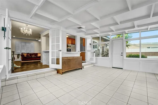a view of a livingroom with furniture and an entryway