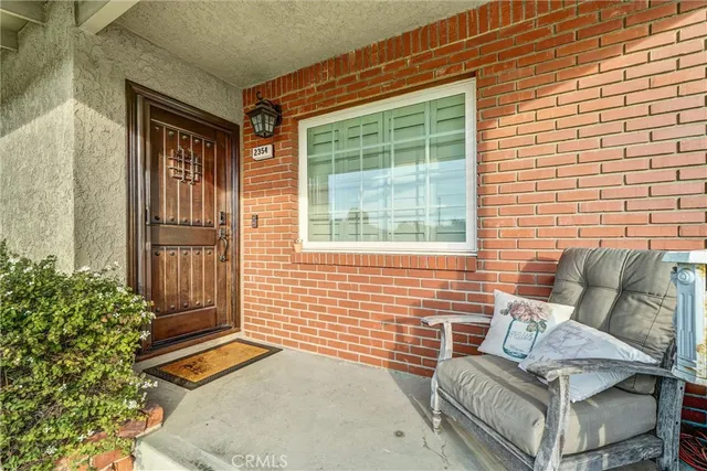 a outdoor living space with furniture and a potted plant
