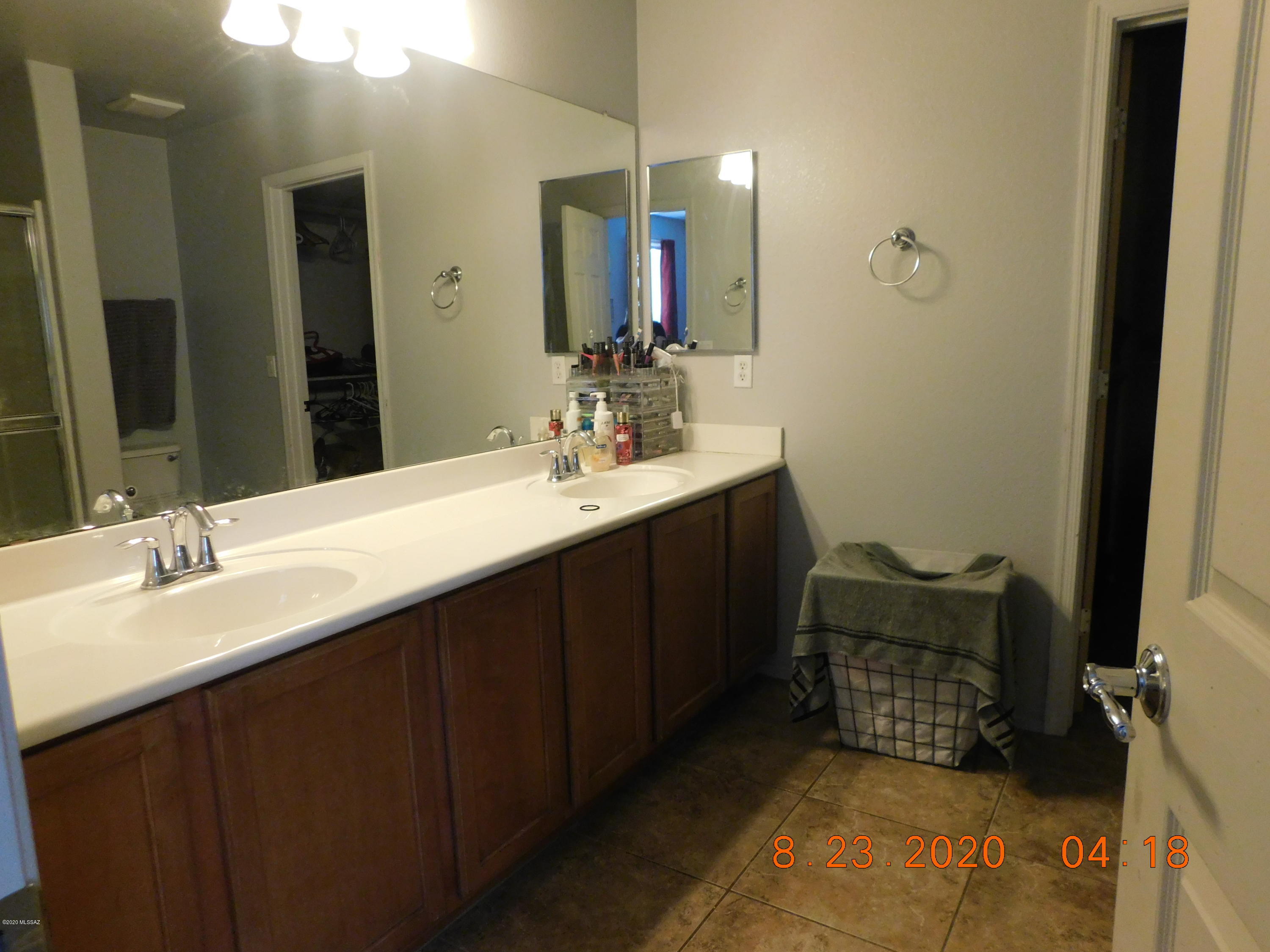 20827 East Reunion Road Red Rock, AZ 85145 - Photo 9 of 19 a bathroom with a double vanity sink and a mirror