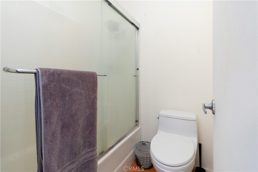 550 Orange Avenue, Unit 318 Long Beach, CA 90802 - Photo 16 of 25 a white toilet sitting next to a shower