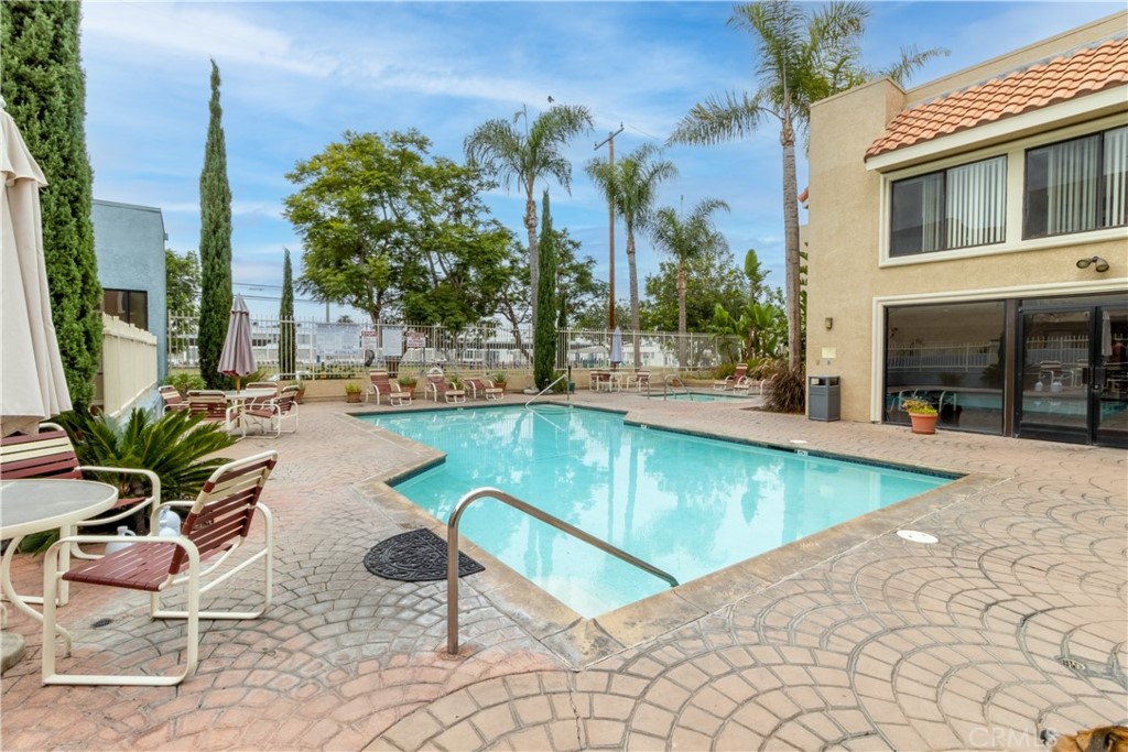 550 Orange Avenue, Unit 318 Long Beach, CA 90802 - Photo 22 of 25 a view of a swimming pool with chairs