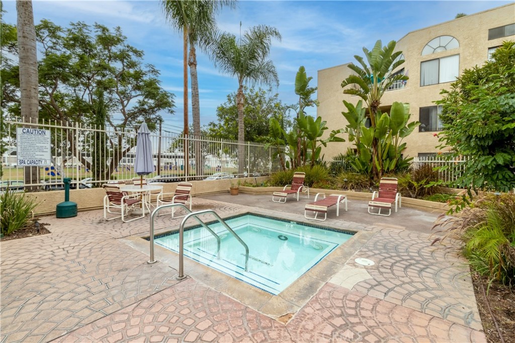 550 Orange Avenue, Unit 318 Long Beach, CA 90802 - Photo 23 of 25 a view of a swimming pool with chairs