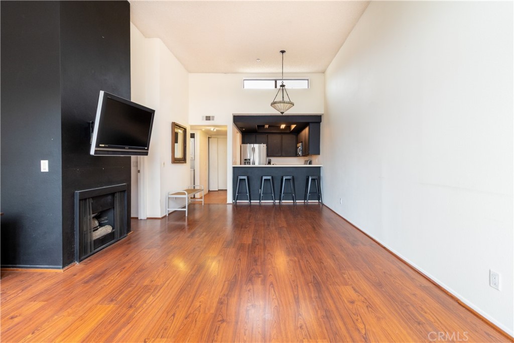 550 Orange Avenue, Unit 318 Long Beach, CA 90802 - Photo 7 of 25 a view of livingroom with furniture fireplace and wooden floor