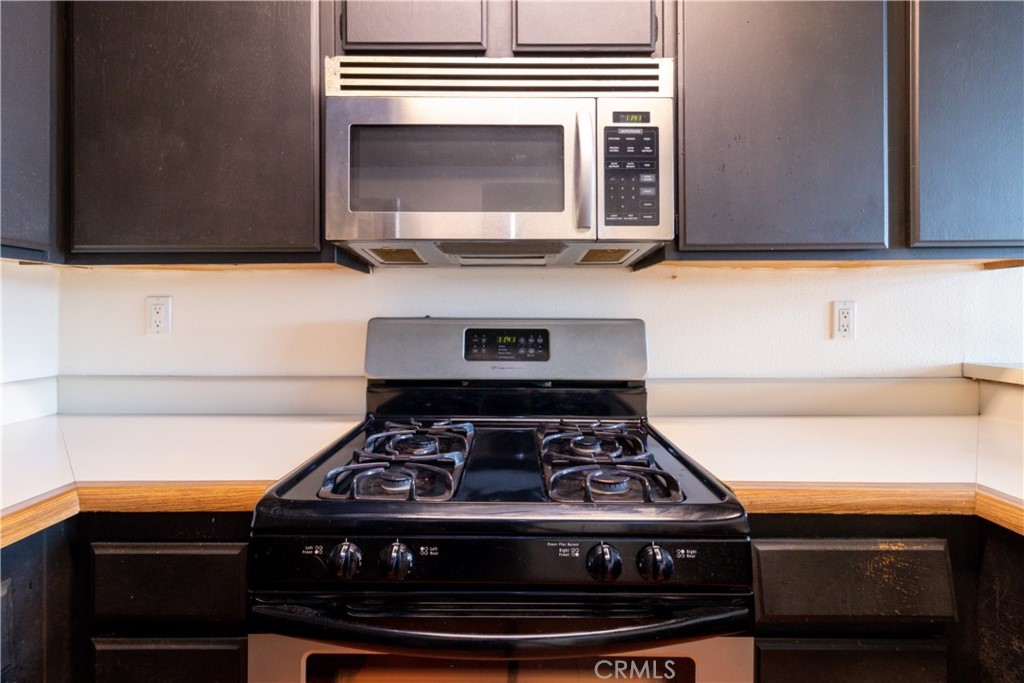 550 Orange Avenue, Unit 318 Long Beach, CA 90802 - Photo 10 of 25 a stove top oven sitting inside of a kitchen