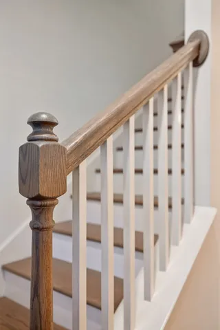 a spacious bedroom with a bed and a chandelier