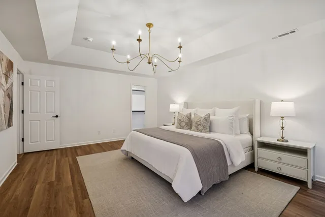 a spacious bathroom with a granite countertop sink mirror and shower