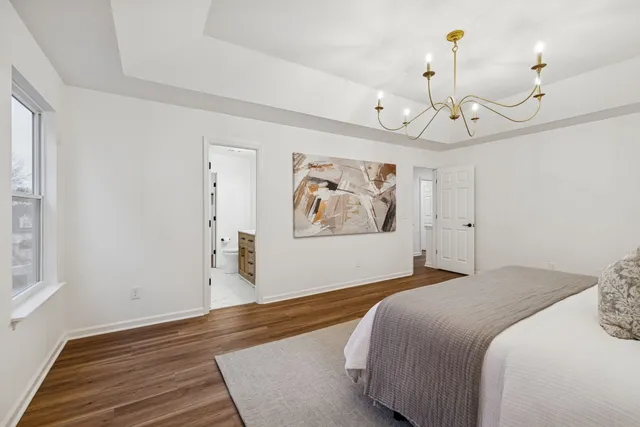 a bathroom with a double vanity sink toilet and shower