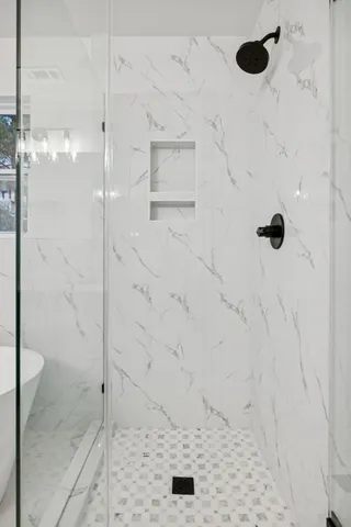 a bathroom with a sink double vanity and a toilet