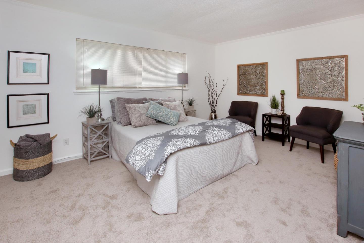3005 Granite Creek Road Scotts Valley, CA 95066 - Photo 17 of 26 a spacious bedroom with a bed and a chair