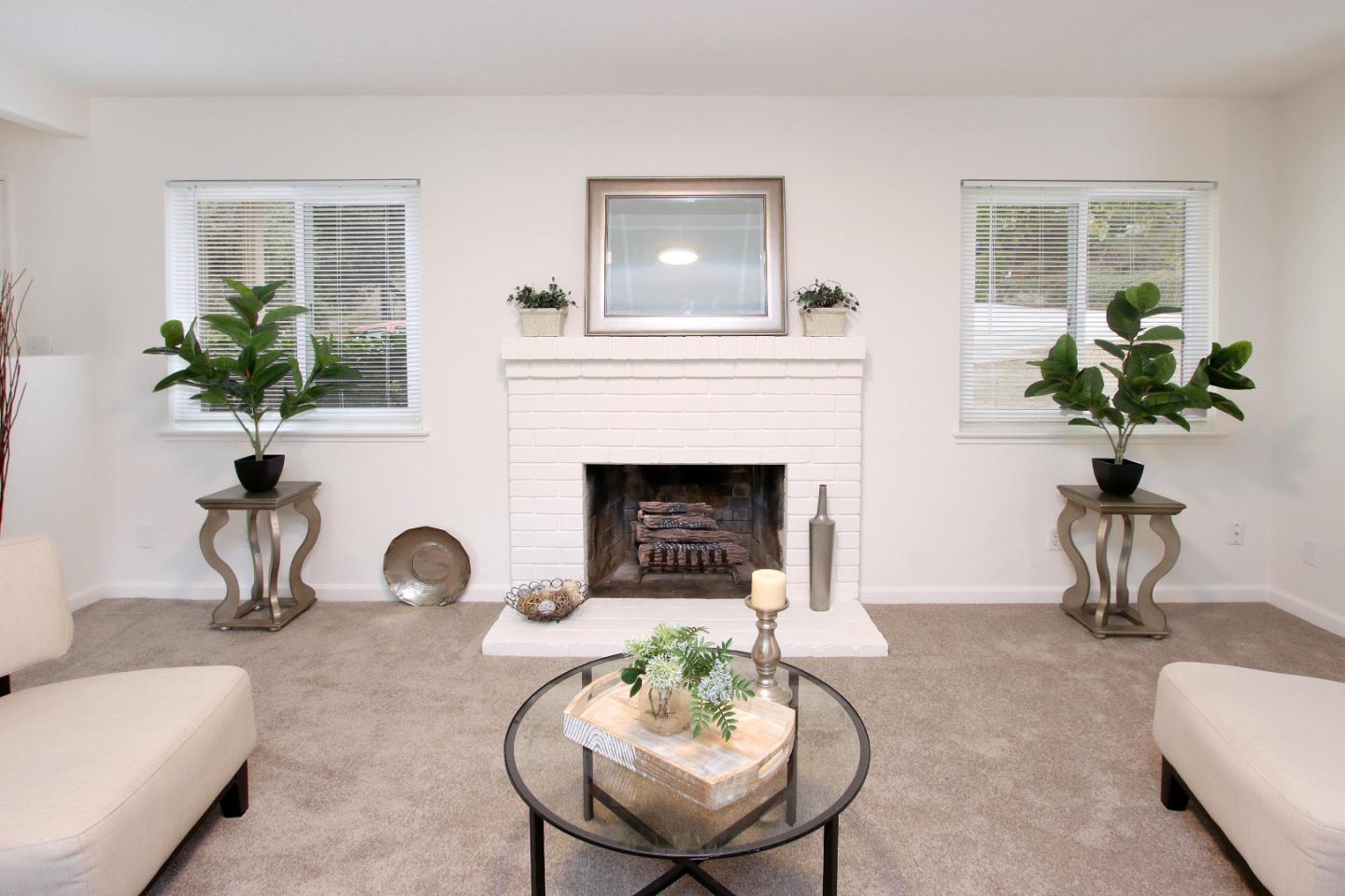 3005 Granite Creek Road Scotts Valley, CA 95066 - Photo 3 of 26 a living room with furniture potted plant and a fireplace