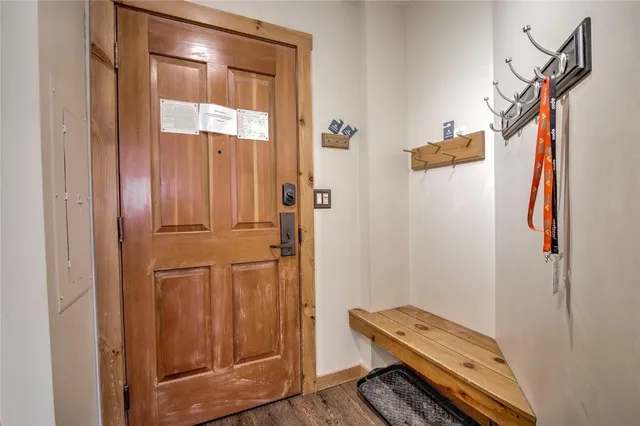 a view of an entryway with wooden floor