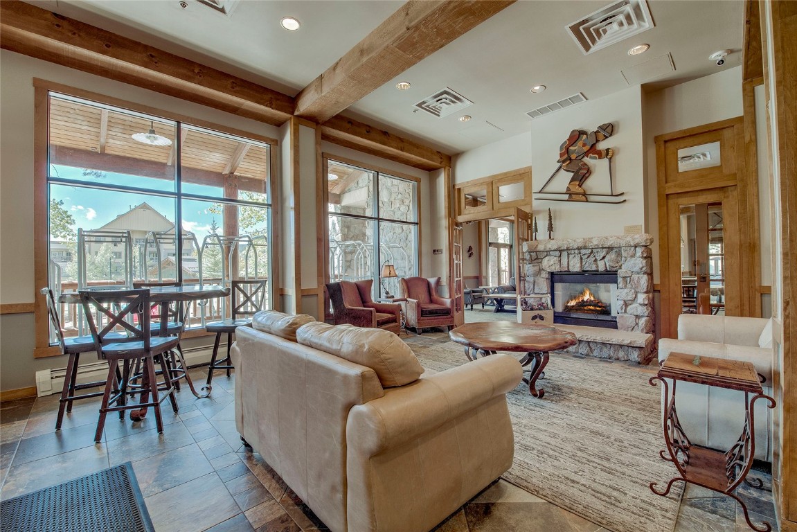 100 Dercum Square, Unit 8380 Keystone, CO 80435 - Photo 30 of 35 a living room with furniture a fireplace and a large window