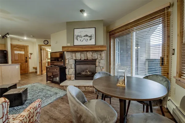a living room with furniture and a table