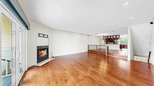 a kitchen with stainless steel appliances granite countertop a sink and a refrigerator