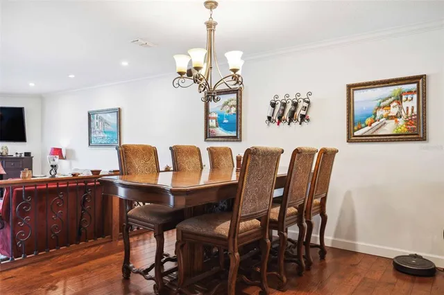 a kitchen with stainless steel appliances granite countertop a sink refrigerator and cabinets