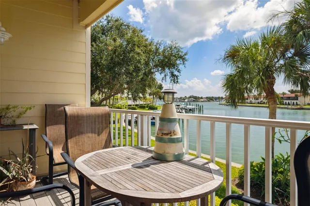 a living room with furniture a fireplace and a floor to ceiling window