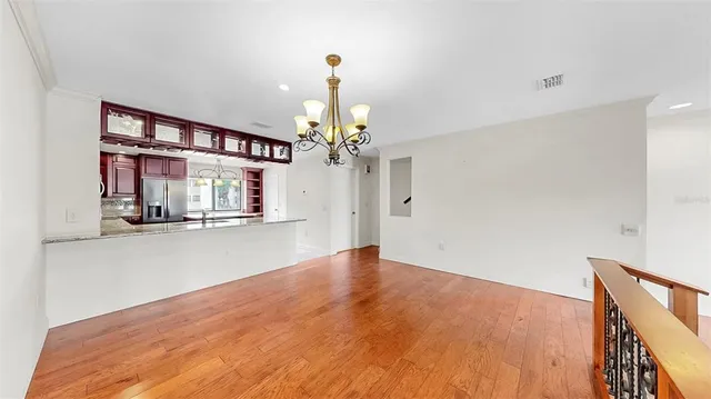 a view of a livingroom with a ceiling fan and window