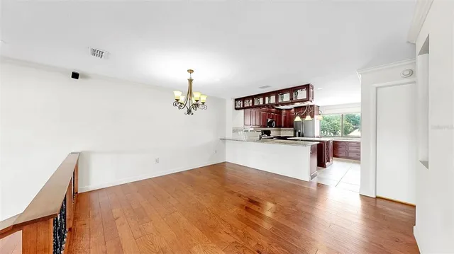 a view of a livingroom with a ceiling fan and window