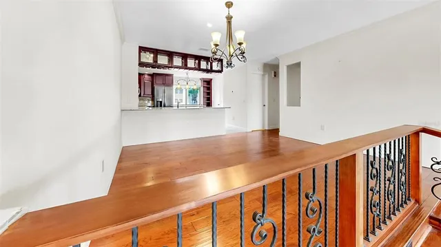 a view of a livingroom with a ceiling fan and window
