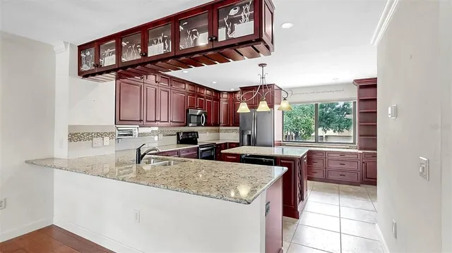 a kitchen with a sink and a refrigerator