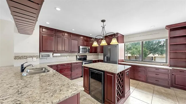 a view of a livingroom with a ceiling fan and window