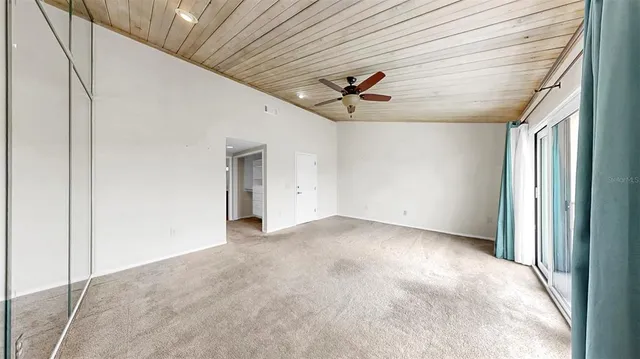 an aerial view of residential houses with outdoor space and lake view