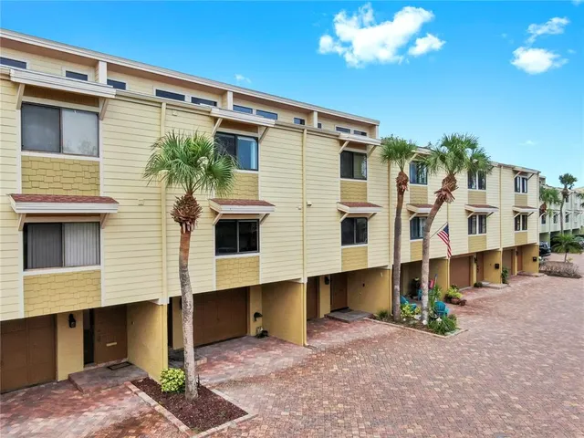 a view of a balcony with furniture and rug