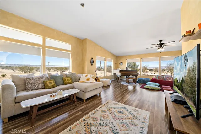 a living room with furniture and a large window