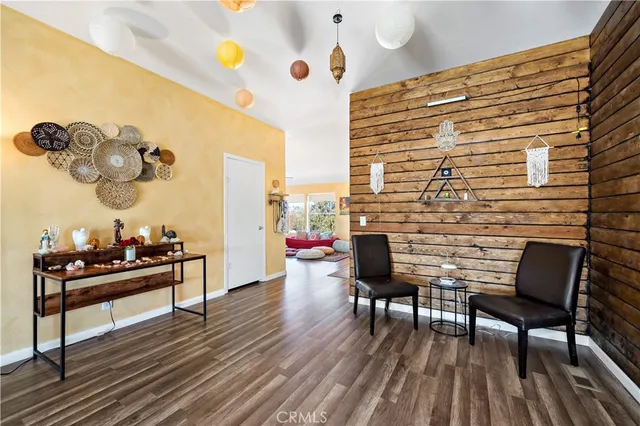 a reading room with furniture and wooden floor