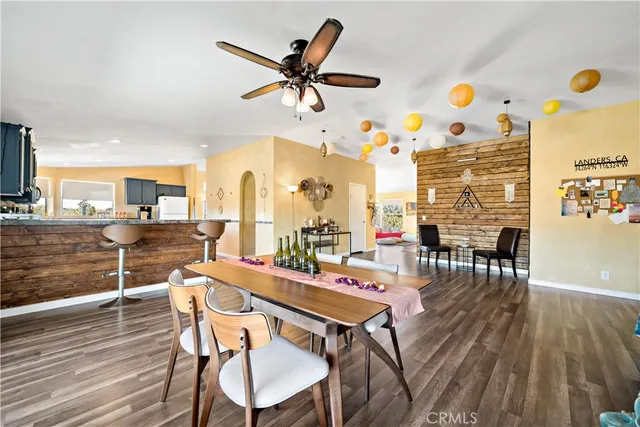 a kitchen with stainless steel appliances granite countertop a refrigerator stove top oven and sink