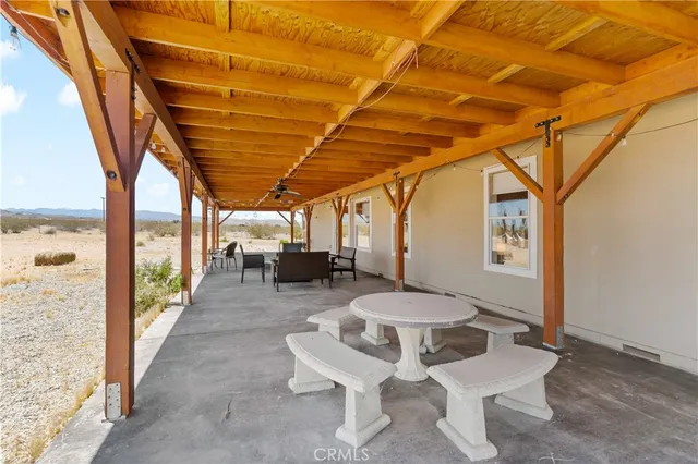 a view of a terrace with furniture and stove