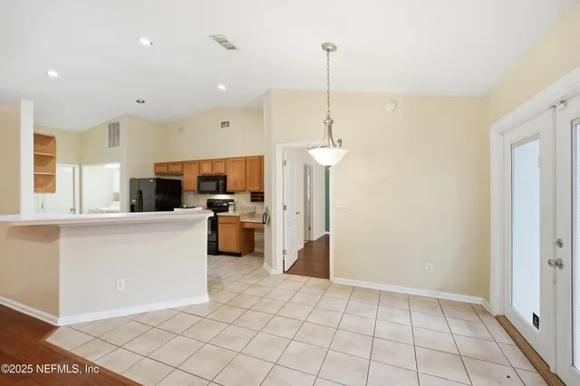 a kitchen with stainless steel appliances a refrigerator sink and microwave