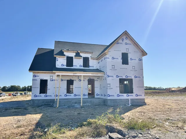 front view of a house with a yard