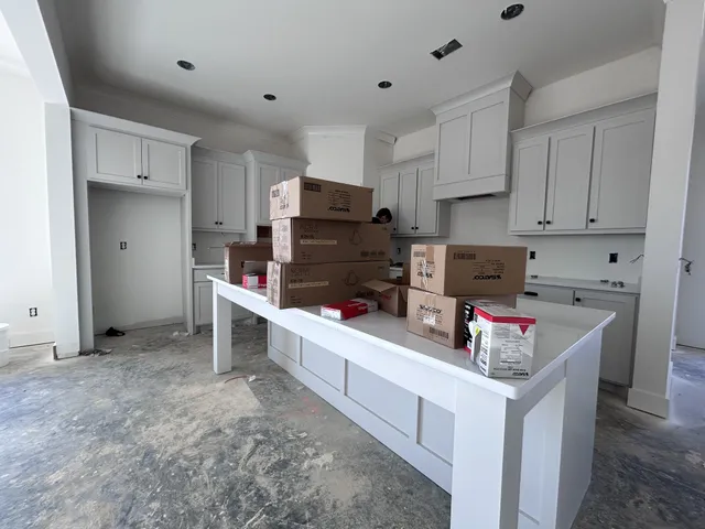a kitchen that has a lot of cabinets in it