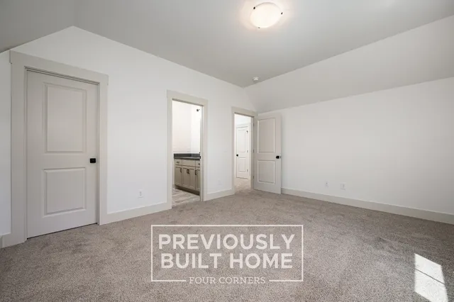 a bathroom with a granite countertop sink a mirror and shower