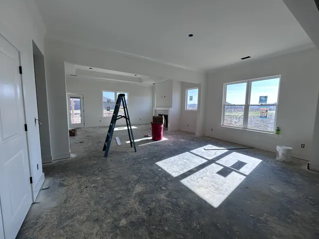a living room with couch and a window