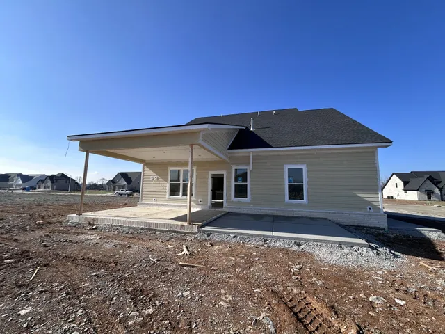 a house with trees in the background