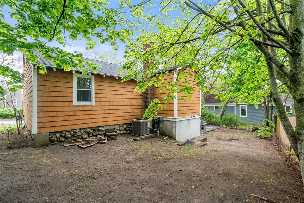 7 Indian Neck Road Wareham, MA 02571 - Photo 33 of 34 a view of a house with backyard and trees