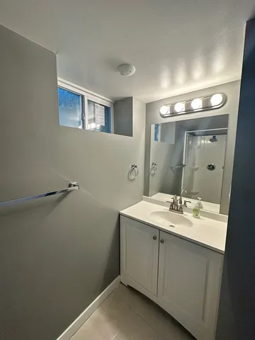 a bathroom with a sink and mirror