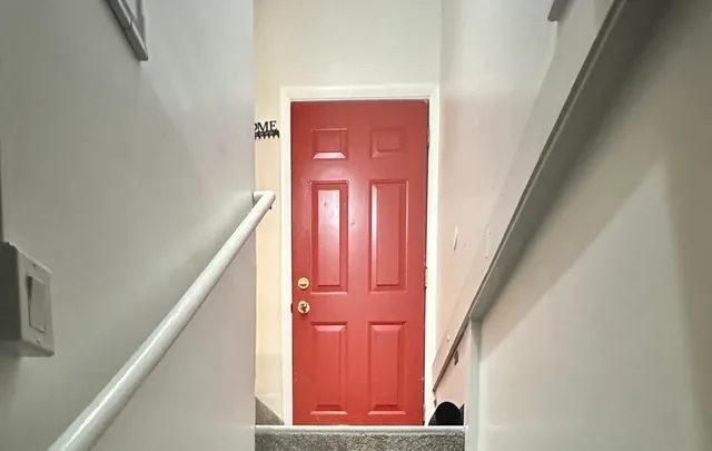 a view of a hallway with staircase