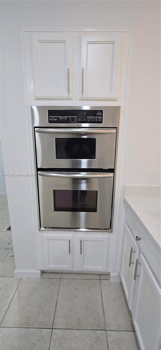 6500 Southwest 82nd Avenue Miami, FL 33143 - Photo 11 of 54 a stove top oven sitting inside of a kitchen