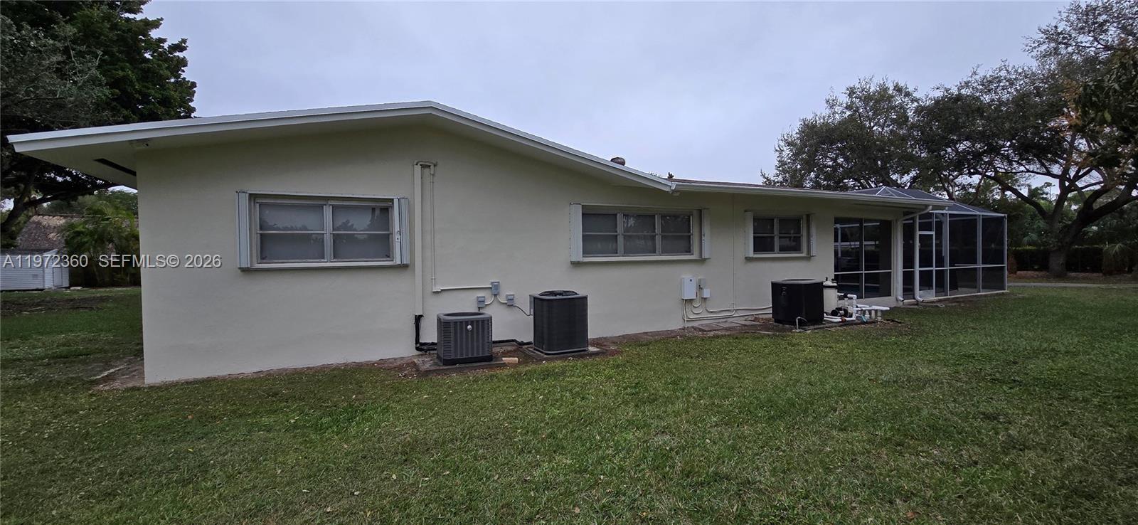 6500 Southwest 82nd Avenue Miami, FL 33143 - Photo 18 of 54 a house view with a garden space
