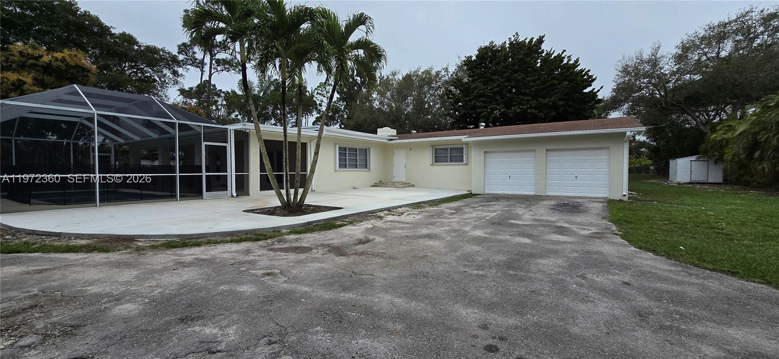 6500 Southwest 82nd Avenue Miami, FL 33143 - Photo 2 of 54 a view of a house with backyard and a tree
