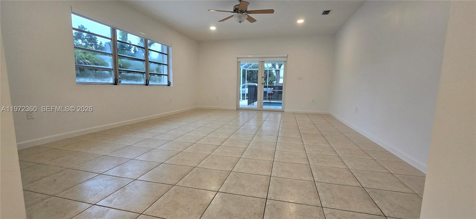 6500 Southwest 82nd Avenue Miami, FL 33143 - Photo 23 of 54 a view of an empty room with a window