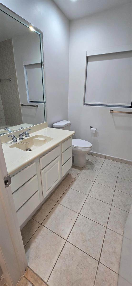 6500 Southwest 82nd Avenue Miami, FL 33143 - Photo 27 of 54 a bathroom with a sink a toilet and mirror