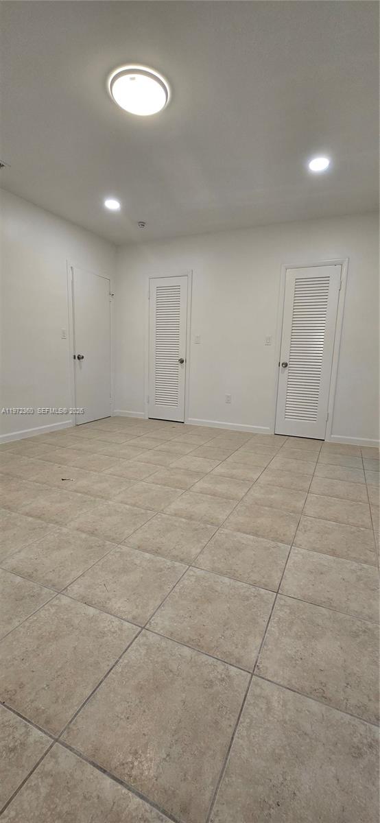 6500 Southwest 82nd Avenue Miami, FL 33143 - Photo 37 of 54 a view of a room with a ceiling fan and window