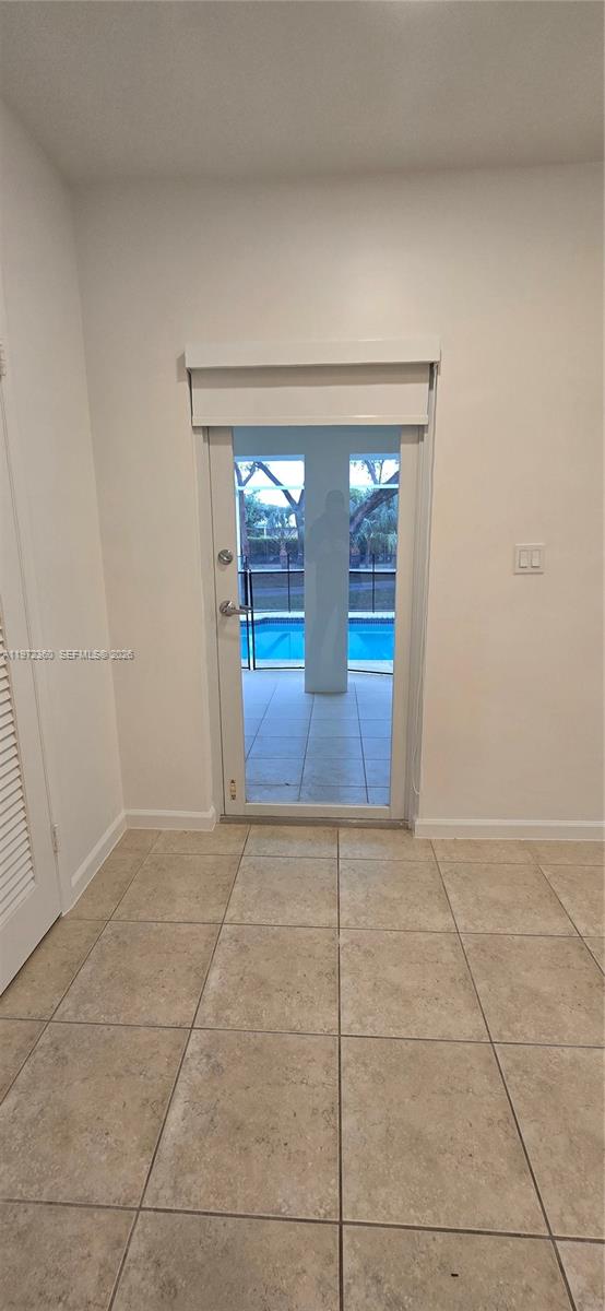 6500 Southwest 82nd Avenue Miami, FL 33143 - Photo 39 of 54 an empty room with entrance and windows